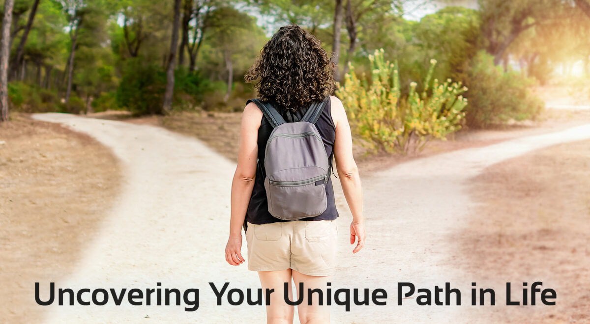 'uncovering your unique path' soul purpose image with woman at fork in road