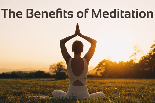 the benefits of meditation text with image of woman in yoga pose in nature