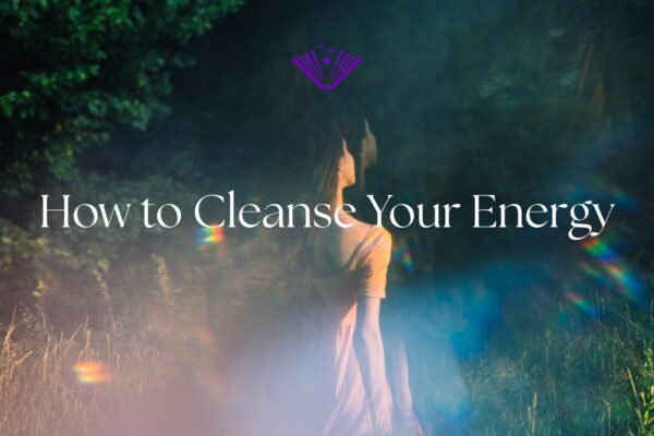How to Cleanse Your Energy text with background image of woman walking through forest