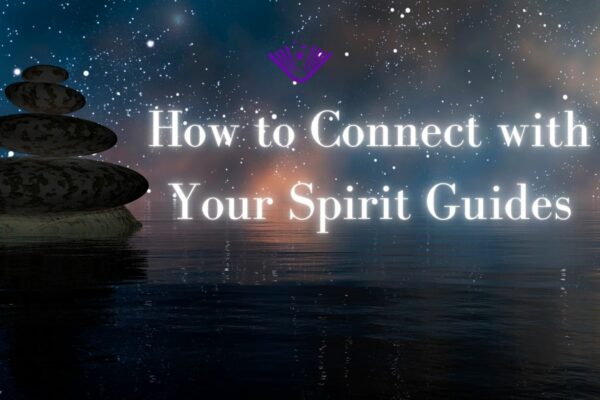 How to Connect with Your Spirit Guides text with background image of stacked rocks with night sky