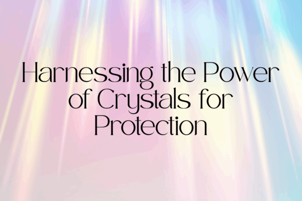 Harnessing the Power of Crystals for Protection text with pink and blue glowing background