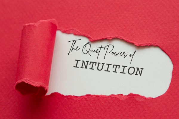 'the quiet power of intuition' text showing through ripped paper